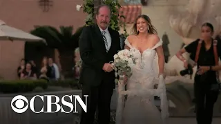 Bride who uses wheelchair walks down aisle