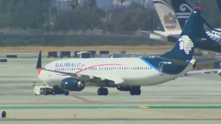 8 injured after passenger jet collides with utility truck at Los Angeles airport