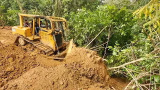 CAT D6R XL Bulldozer Repairs Hill Roads by Pushing Soil into a Ravine