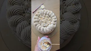 Decorating a Bento cake with sprinkles and buttercream piping