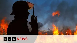 Canada wildfires: Winds push fires away from oil hub after residents flee homes | BBC News