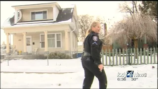 Police officers help family with Christmas gifts