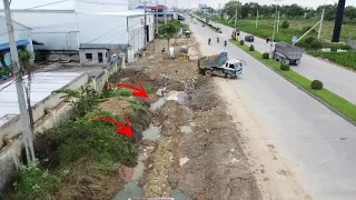 New Project Techniques Push Stone Clearing drainage system Next to Highway Road to Create a walkway