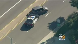 Carjacking Suspect Surrenders To Police After Standoff, Pursuit