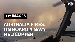 People evacuated after being trapped by Australian bush fires | AFP