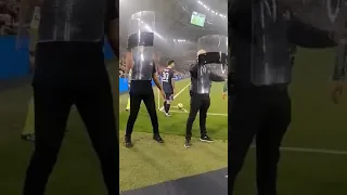 fans throw bottles at Messi