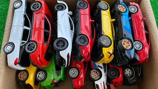 Box full of diecast Cars, McLaren, Lexus LC500, Lamborghini, Porsche, Supra, Honda, Camry.