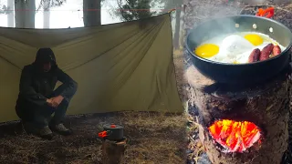 Solo Camping in Heavy Rain - making a Swedish Torch