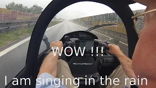 WOW !!!      Rain Ride "inside" a cabin motorcycle with electric drive