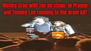 Nikki Sixx with fan on stage and Tommy runs to the drum kit - Motley Crue at Prague Rocks Praha 2023
