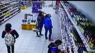 Shop Shelves Full With Alcohol Bottles Fall Almost Crushing Worker and Customers CCTV