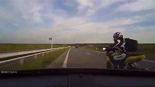 Russian Biker Brake Checks Car And Pays The Price