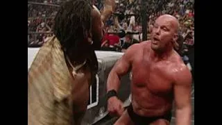 Booker T attacks "Stone Cold" Steve Austin, starting the