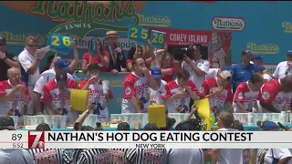 Defending champ Chestnut sets record with 74 hot dogs