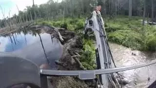 Busting A Beaver Dam!  Mini Bobcat Excavator Mud Stuck Water Creek