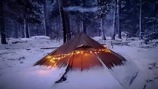 Hot tent winter camping in a snowstorm