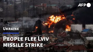 People flee site of missile strike on Lviv | AFP