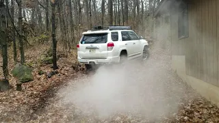 2010 Toyota 4runner 4x4 backyard offroading in slick mud. 2 inch OME lift