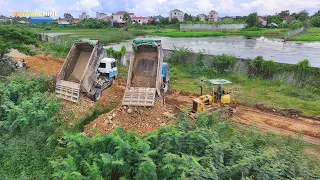 The Update project shows the Land Filling By Dozer Komatsu mini Pushing stone and soil.