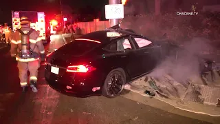 Tesla Slams Into Pole And Catches on Fire