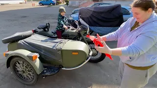 Family washing Ural motorcycle first time