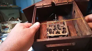 How to adjust a hammer to  hit the gong in a cuckoo clock when there is no hole in back door.
