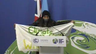 Protester hijacks mic, shouts 'COP26 has been a failure!' | AFP