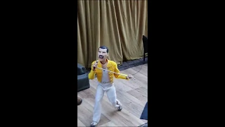 Freddie Mercury dances as a puppet street performance