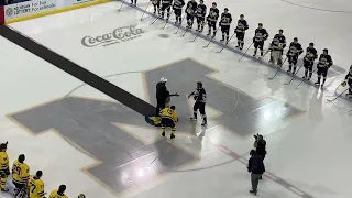 Sherrone Moore drops honorary first puck at Michigan hockey game