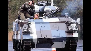 Princess Diana drives a tank on her visit to West Germany in 1985