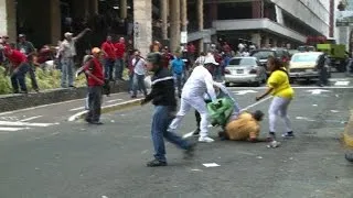 Venezuelan opposition and Chavistas clash in Caracas