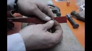 using my MORA KNIFE, homemade LEATHER SHEATH for AXE.wmv