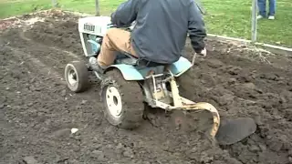 Plowing with sears suburban 12 garden tractor