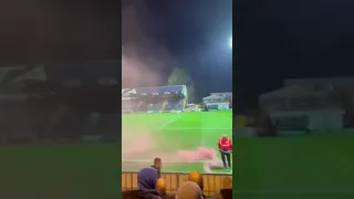 Salford fans with a pyro at Stockport