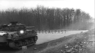 Convoy of vehicles in outskirts of town near wounded area and soldier atop truck ...HD Stock Footage