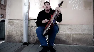 Svyatoslav Hrytsak plays bandura on the streets of Lviv