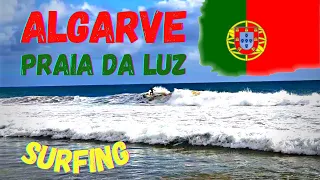 Surfing Portugal. Beautiful Algarve beach, Praia da Luz! Christmas Day surf