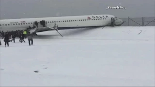 Plane Crashes Through Fence at LaGuardia Airport