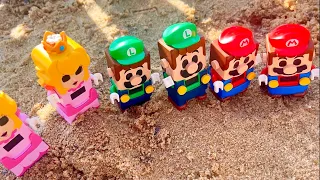 LEGO Mario builds a huge sand castle. Can Super Mario, Luigi and Peach stop Bowser's attack?