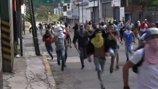 Protesters clash with police in Venezuela on day of mass protest