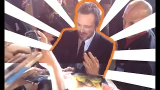 Aaron Paul and Kid Cudi sign autographs for fans at the Need for Speed Premiere