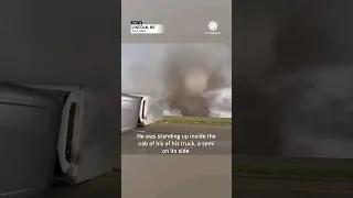 Storm Chaser Checks on Trucker Flipped by Tornado