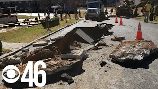 Dump truck collapses roadway, crews repairing water main break in DeKalb County