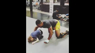 Francis Ngannou wrestling a child