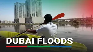 Volunteers use kayaks to help Dubai residents stranded by flood waters | ABS-CBN News