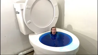 GOING UNDER in Worlds Largest Toilet BLUE SWIMMING POOL