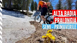 The first shy gravel bike ride amidst a snow patched Dolomites landscape · Alta Badia