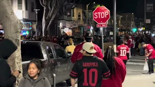 49ers fans celebrate NFC win in the Mission district of San Francisco.