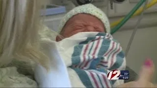 Newborns comforted by "volunteer cuddlers"