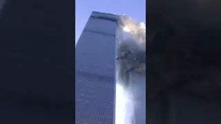 Reporter on camera as tower begins to collapse